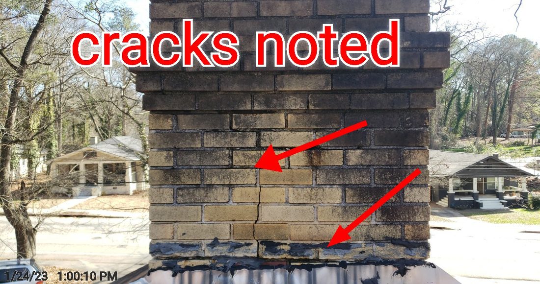Cracks noted running through the masonry chimney