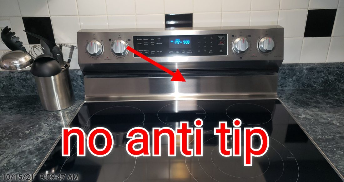 A kitchen range installed without an anti-tip bracket
